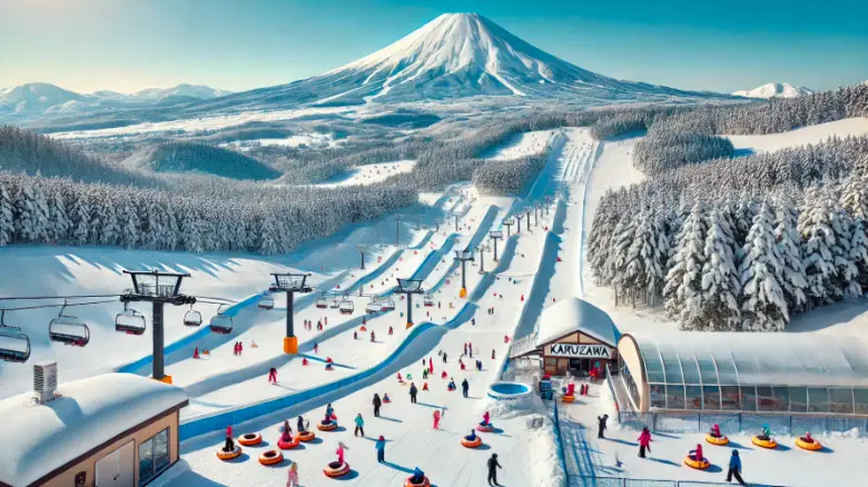  軽井沢スノーパークの雪景色、青空と浅間山を背景にしたスキーエリア。